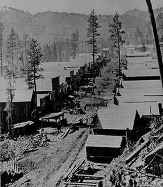 A photograph of Deadwood in 1876. General view of the Dakota Territory gold rush town from a hillside above. By S. J. Morrow.