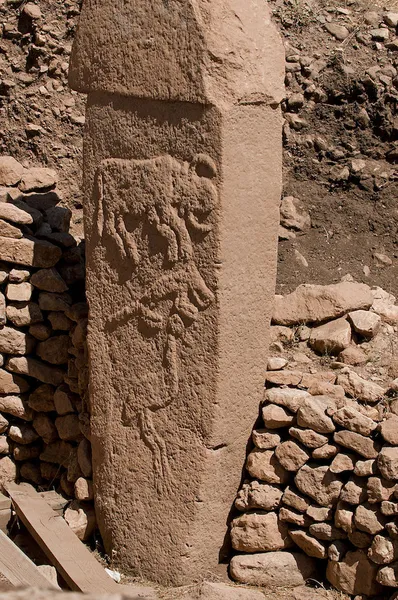 Gobekli Tepe, Urfa. Pillar 2 from Enclosure A (Layer III) with low reliefs of what are believed to be a bull, fox, and crane. Photo taken 6 September 2011 by Teomancimit