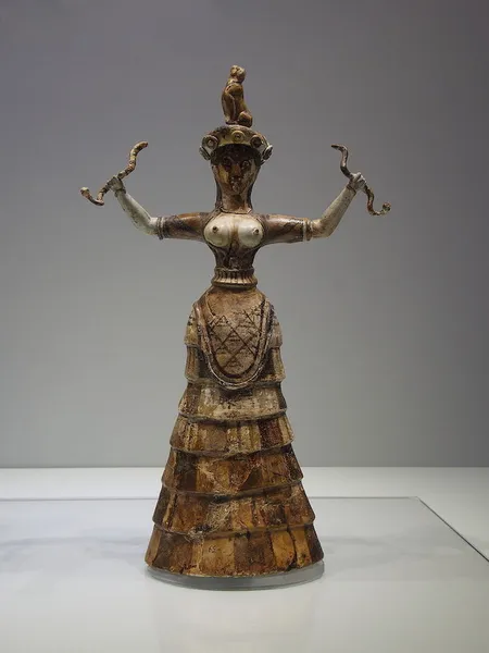 Archaeological Museum of Herakleion. The smaller of the two statues of the snake goddess, the one holding two snakes, one with each hand. It is considered to depict the ground goddess of a snake, maybe the daughter of the goddess. (photo taken 14 February 2015, 14:51:44 by C messier)