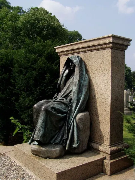 Augustus Saint-Gaudens: The Adams Memorial in Section E of Rock Creek Cemetery, Washington, D.C. Erected in 1891. Commissioned by Henry Adams as memorial to his wife, Clover Adams. Bronze allegory of The Mystery of the Hereafter and The Peace of God that Passeth Understanding (often called Grief), in a setting designed by en:Stanford White. Photo by Dan Vera, 14 December 2007.