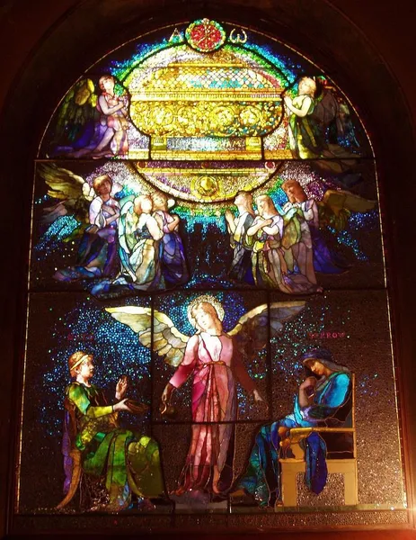 Photograph of a stained glass window entitled "Angel of Help" by John LaFarge (1835-1910), made 1886, in the Unity Church, North Easton, Massachusetts, USA. Window restored by Victor Rothman for Stain